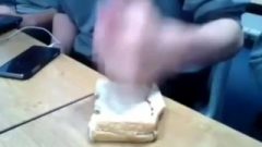 Two White Men Aggressiviely Fill A White Batty In A Classroom